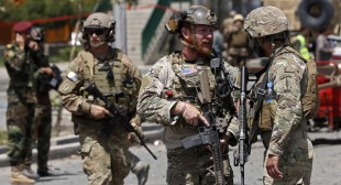 Afghan, US officials sign long-awaited pact to ensure troops stay past 2014