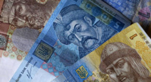 Ukrainian currency plunges to new record low