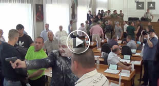 Wild West Ukraine: Thugs pour milk on politician at council meeting, he draws his gun (VIDEO)